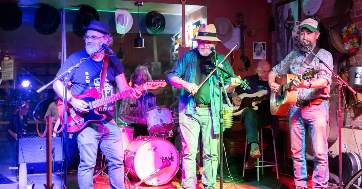 Band performing live music in a colorful venue.