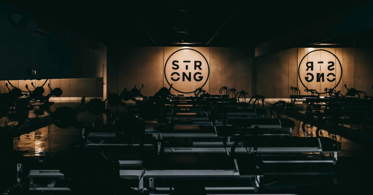Interior of a dimly lit space with strong typography on walls.